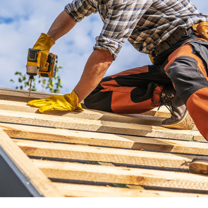 DIY RentalsContractor working on a roof on a clear day